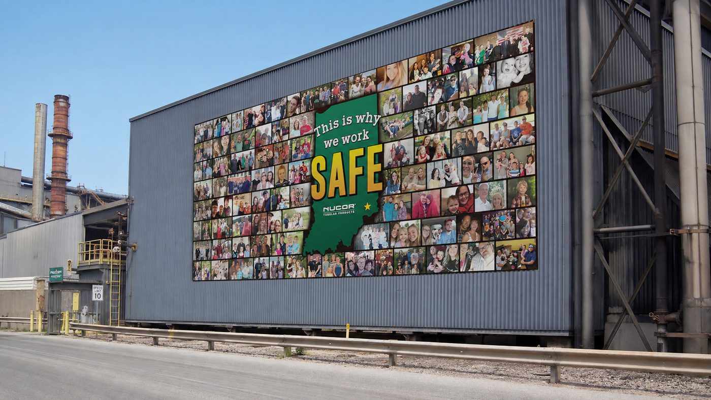 Building banner installed on a Nucor plant elevation